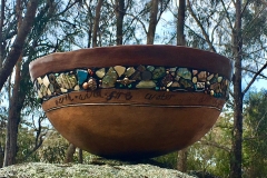 Yolande Clarkson. Madre Tierra -" earth, wind, fire and water ... we are of you", hand built burnished terracotta with found objects.